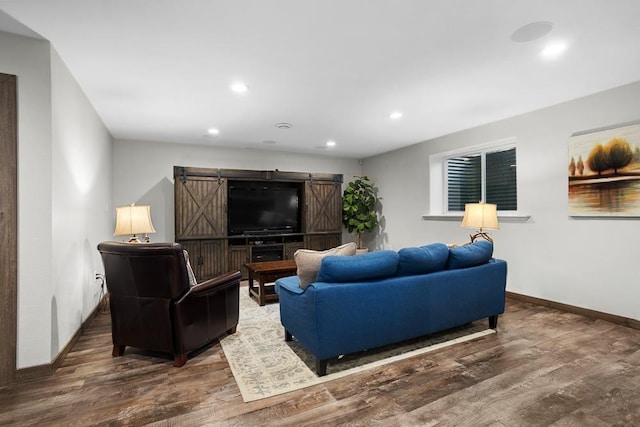 1804 Valley Bluffs Dr, Minot, ND 58701 - living area with recessed lighting, wood finished floors, a barn door, and baseboards