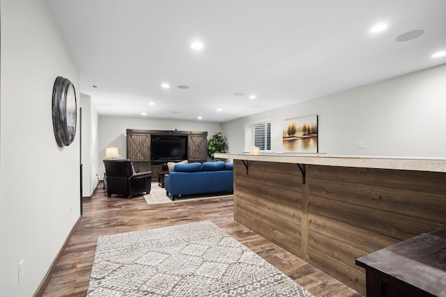 1804 Valley Bluffs Dr, Minot, ND 58701 - living room featuring recessed lighting, wood finished floors, and baseboards