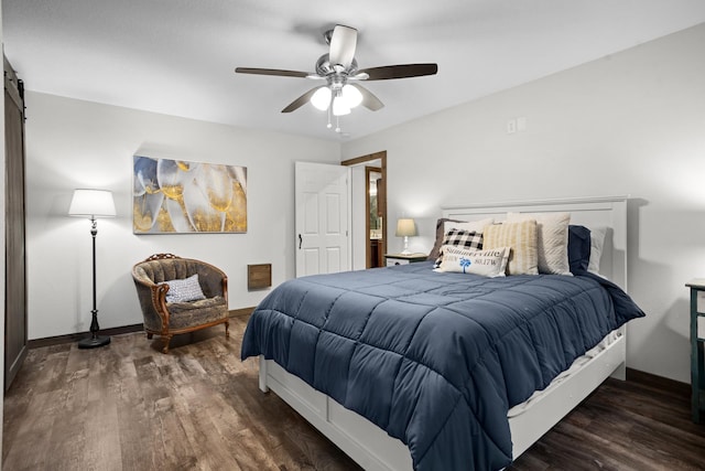 1804 Valley Bluffs Dr, Minot, ND 58701 - bedroom with wood finished floors, baseboards, a barn door, and ceiling fan