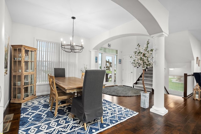 1804 Valley Bluffs Dr, Minot, ND 58701 - dining space with healthy amount of natural light, a chandelier, arched walkways, and hardwood / wood-style flooring