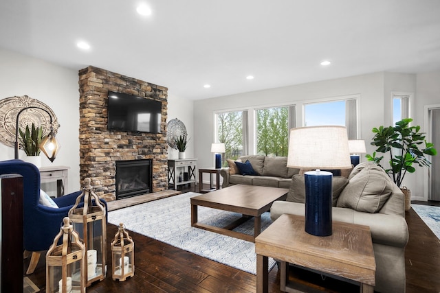 1804 Valley Bluffs Dr, Minot, ND 58701 - living area with dark wood-style flooring, a fireplace, and recessed lighting