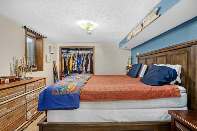 917 17th St Unit 0, Minot, ND 58703 - bedroom featuring a closet and a textured ceiling