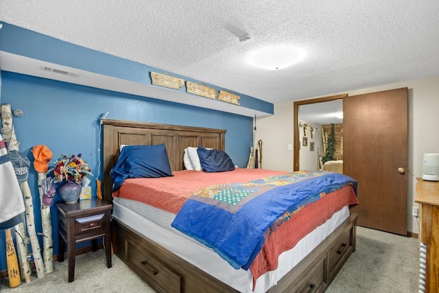 917 17th St Unit 0, Minot, ND 58703 - carpeted bedroom with a textured ceiling