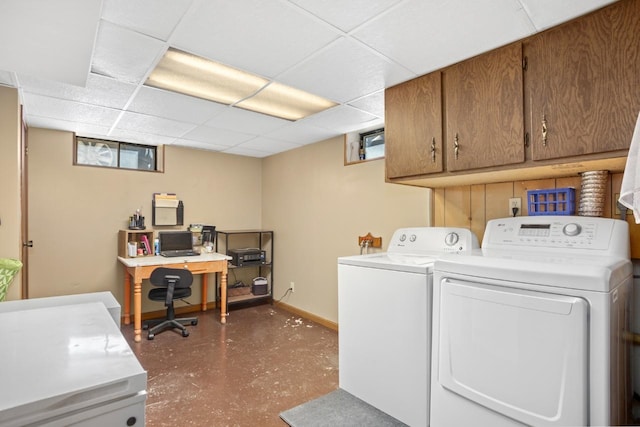 917 17th St Unit 0, Minot, ND 58703 - laundry area featuring separate washer and dryer, cabinet space, plenty of natural light, and baseboards
