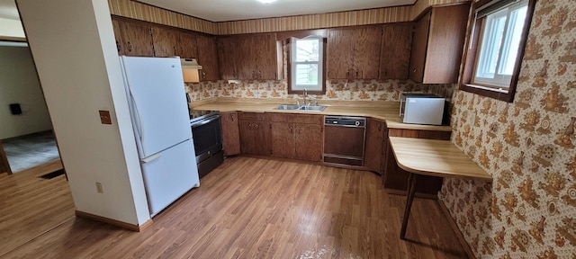 101 Central Ave, Des Lacs, ND 58733 - kitchen featuring dishwashing machine, a sink, freestanding refrigerator, range with electric stovetop, and light countertops