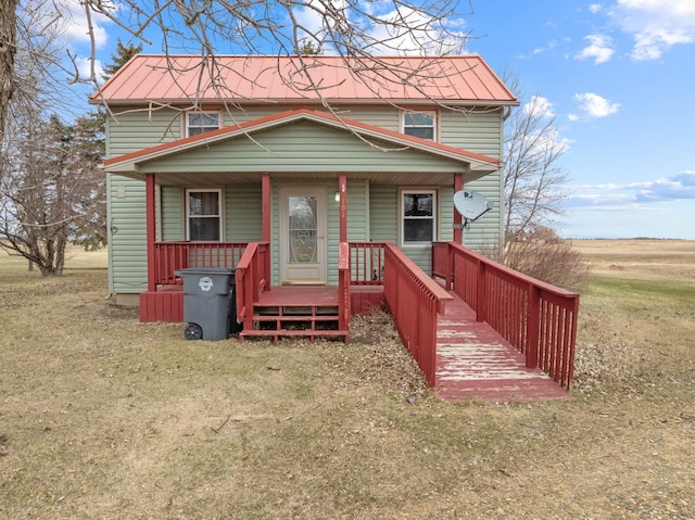 101 Central Ave, Des Lacs, ND 58733 - view of front facade with a porch