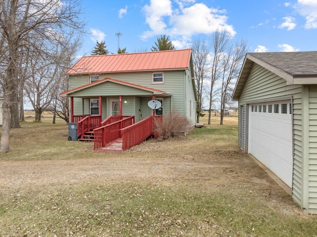 101 Central Ave, Des Lacs, ND 58733 - view of front of house featuring a porch and a detached garage