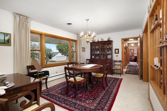 10010 128th St, Burlington, ND 58722 - dining space with a chandelier and a baseboard heating unit