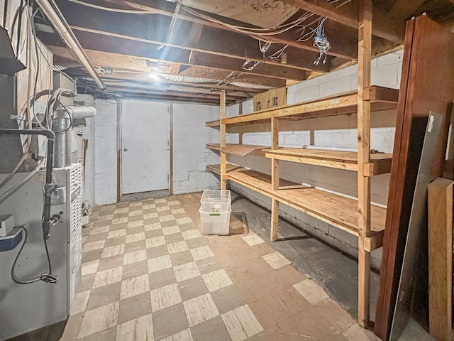 801 19th St, Minot, ND 58703 - unfinished basement featuring tile patterned floors and heating unit