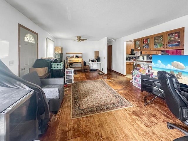 801 19th St, Minot, ND 58703 - office with dark wood-type flooring and ceiling fan