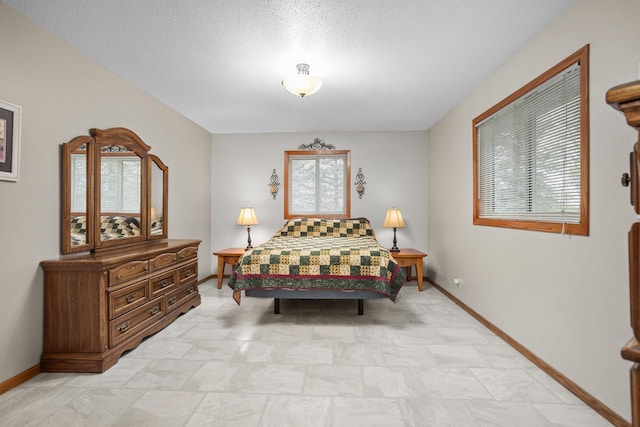 3900 16th St, Minot, ND 58703 - bedroom featuring baseboards