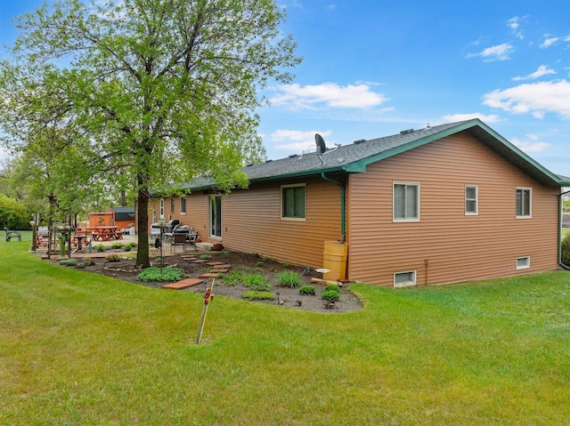 3900 16th St, Minot, ND 58703 - back of house with a patio area and a yard