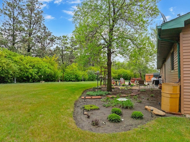 3900 16th St, Minot, ND 58703 - view of green lawn with a patio