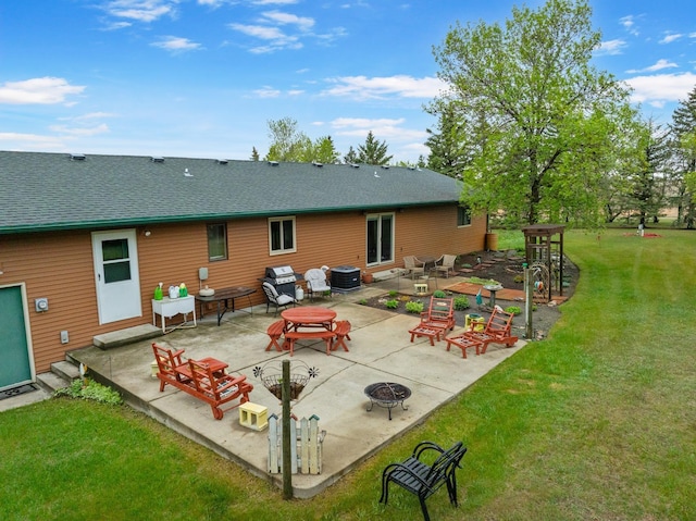 3900 16th St, Minot, ND 58703 - rear view of property with central air condition unit, a yard, a fire pit, a shingled roof, and a patio area
