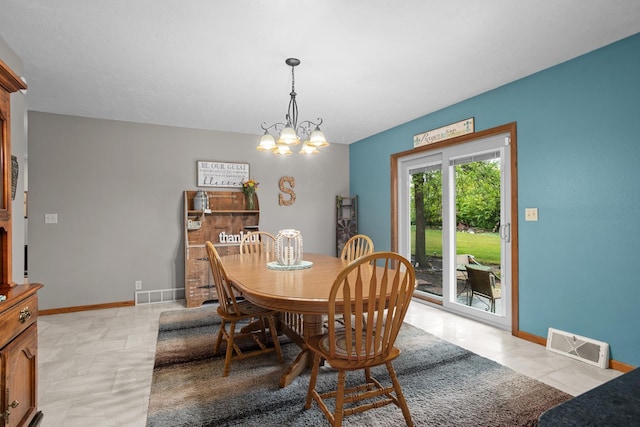 3900 16th St, Minot, ND 58703 - dining space with a chandelier and baseboards