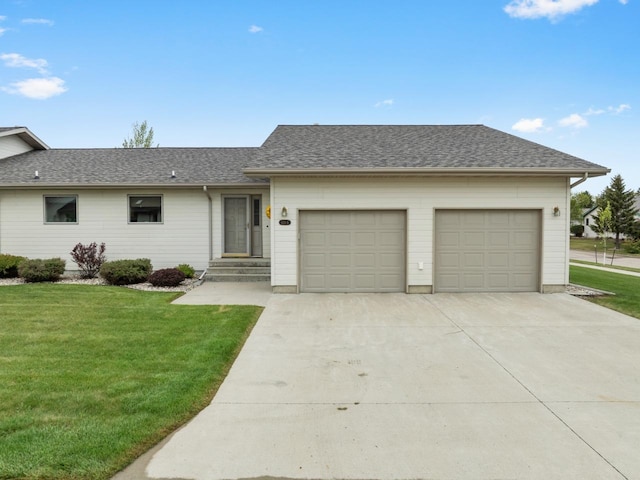 625 34th Ave Unit A, Minot, ND 58701 - single story home with concrete driveway, a front yard, an attached garage, and roof with shingles