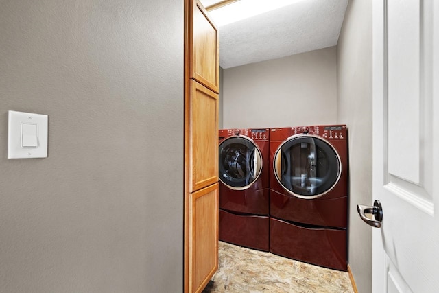 625 34th Ave Unit A, Minot, ND 58701 - washroom with cabinet space and separate washer and dryer