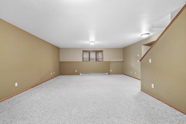 625 34th Ave Unit A, Minot, ND 58701 - basement featuring baseboard heating, carpet floors, and baseboards