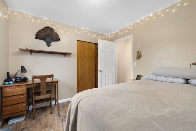 1816 7th St, Minot, ND 58703 - bedroom with wood finished floors and baseboards