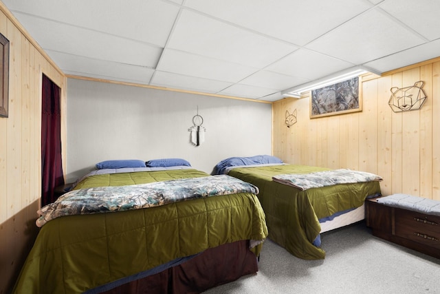 1816 7th St, Minot, ND 58703 - bedroom featuring wooden walls, carpet flooring, and a paneled ceiling