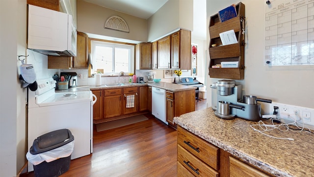 200 E 1st St, Velva, ND 58790 - kitchen featuring stove, dishwasher, brown cabinetry, and dark wood-style floors