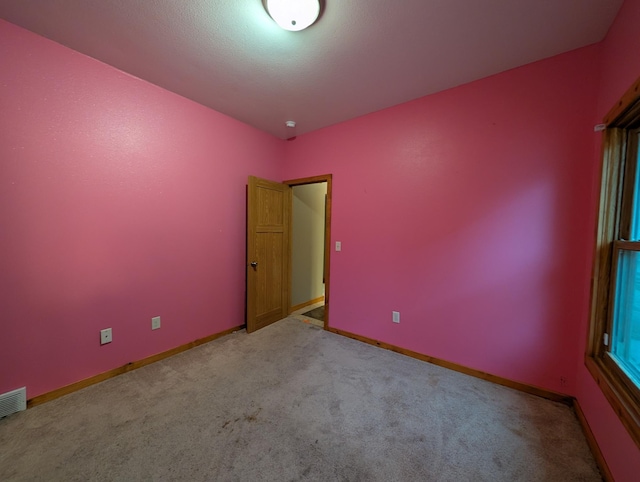 807 NW 8th St, Minot, ND 58703 - carpeted spare room with baseboards