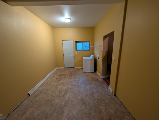 807 NW 8th St, Minot, ND 58703 - laundry room with stone floors, washer / dryer, and baseboards