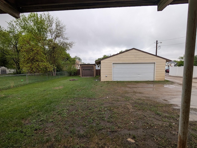 807 NW 8th St, Minot, ND 58703 - view of yard with an outbuilding and a detached garage