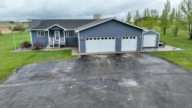 3030 Mustang Trl, Minot, ND 58703 - single story home featuring asphalt driveway, a front yard, and a garage