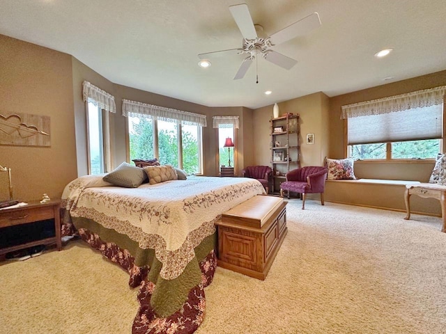 2900 8th St, Minot, ND 58701 - bedroom with light colored carpet, recessed lighting, and ceiling fan