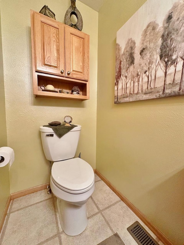 2900 8th St, Minot, ND 58701 - bathroom with toilet and baseboards