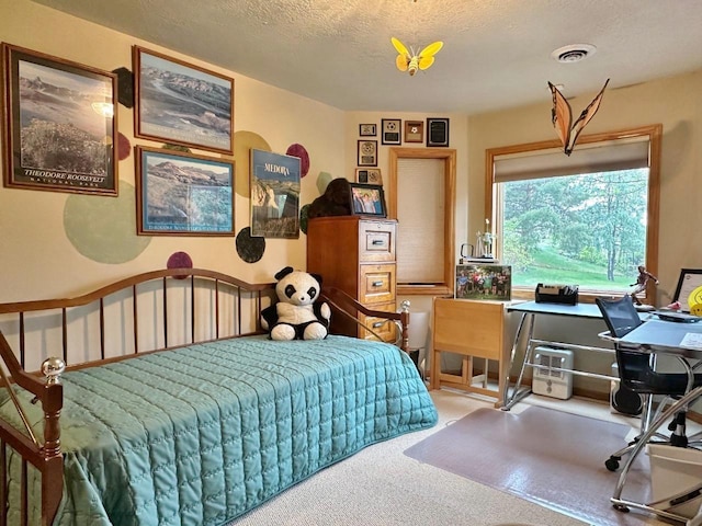 2900 8th St, Minot, ND 58701 - bedroom featuring carpet, a textured ceiling, and an office area