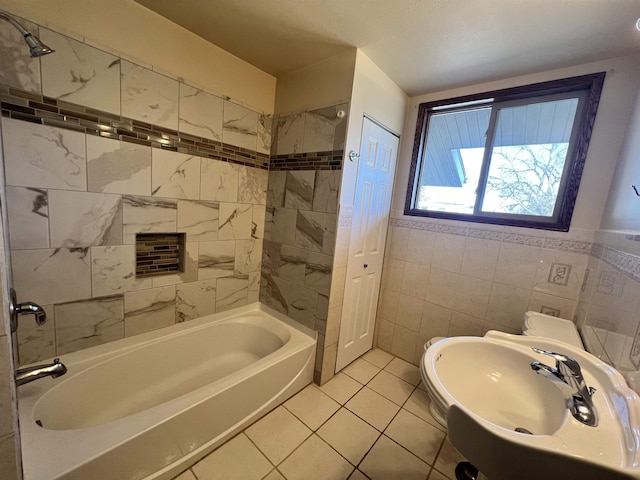 1003 NW Harrison Dr, Minot, ND 58703 - full bath with a sink, shower / bath combination, tile patterned floors, and tile walls