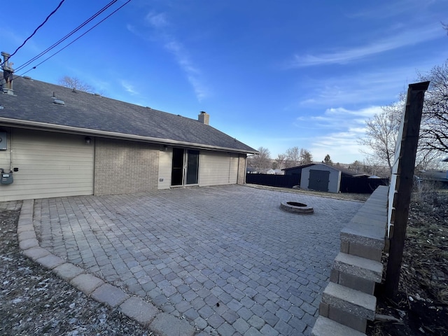 1003 NW Harrison Dr, Minot, ND 58703 - garage featuring a storage unit