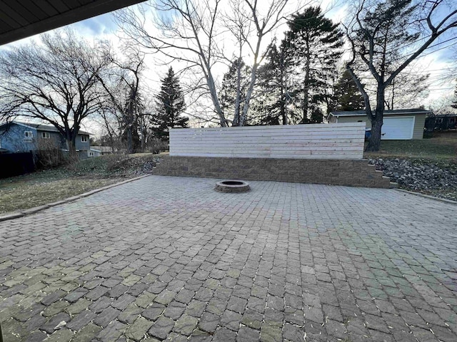 1003 NW Harrison Dr, Minot, ND 58703 - view of patio / terrace with a fire pit