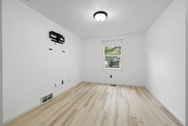1111 15th St, Minot, ND 58703 - unfurnished room with wood finished floors and baseboards