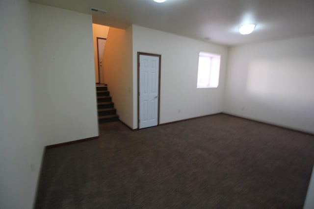 1512 47th Loop, Minot, ND 58701 - unfurnished room with carpet flooring and stairway