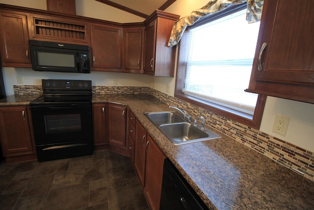 1512 47th Loop, Minot, ND 58701 - kitchen featuring black appliances, a sink, dark countertops, lofted ceiling, and decorative backsplash