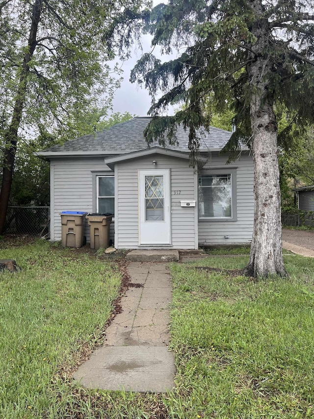 912 Valley St, Minot, ND 58701 - bungalow-style home with a shingled roof