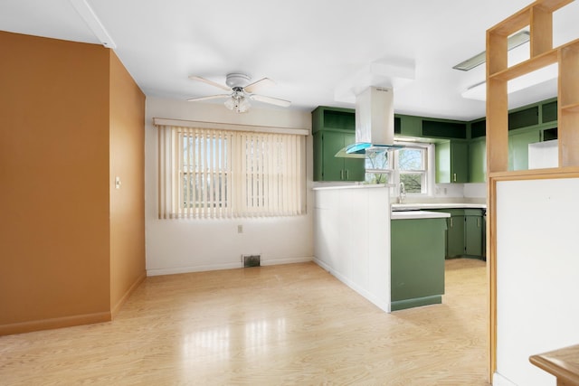 1200 9th St, Minot, ND 58703 - spare room with ceiling fan, light wood-style floors, and baseboards