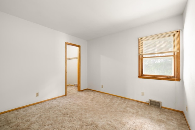 1200 9th St, Minot, ND 58703 - carpeted empty room with baseboards