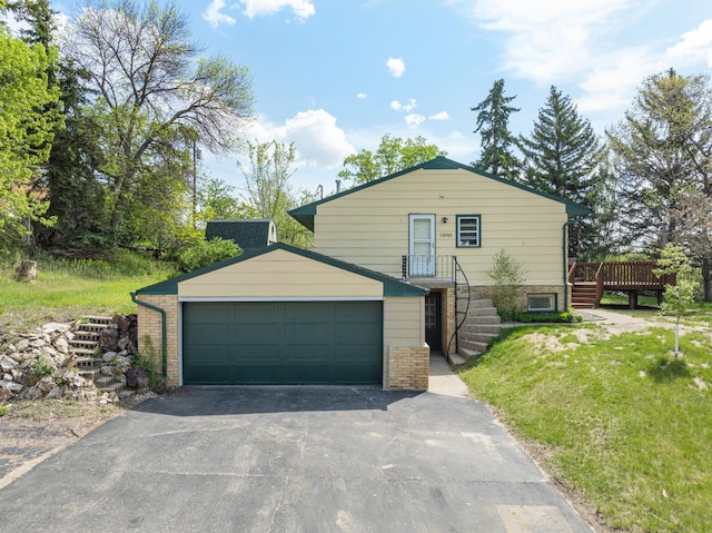1200 9th St, Minot, ND 58703 - view of front of home with a detached garage and a wooden deck
