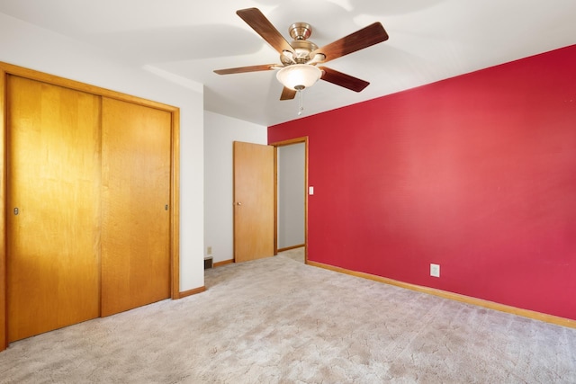 1200 9th St, Minot, ND 58703 - unfurnished bedroom with carpet floors, a closet, baseboards, and a ceiling fan