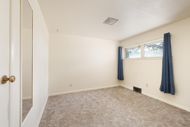 1200 9th St, Minot, ND 58703 - carpeted empty room featuring baseboards