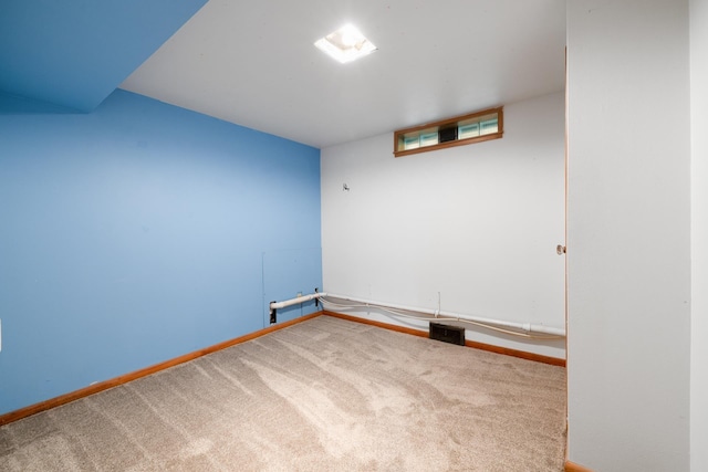 1200 9th St, Minot, ND 58703 - spare room featuring carpet flooring and baseboards