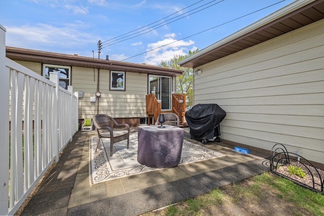 1213 Sunset Blvd, Minot, ND 58703 - view of patio with grilling area and outdoor lounge area