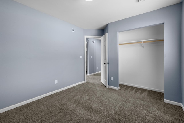 205 17th St, Minot, ND 58703 - unfurnished bedroom featuring carpet floors, baseboards, and a closet
