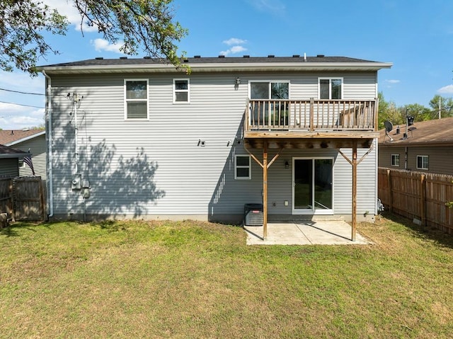 205 17th St, Minot, ND 58703 - rear view of house featuring a patio