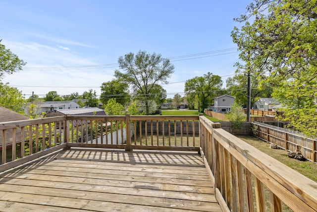 205 17th St, Minot, ND 58703 - deck with a fenced backyard and a residential view