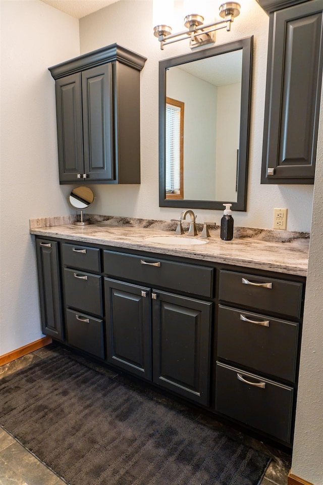 3700 10th Ave, Minot, ND 58701 - bathroom with double vanity and baseboards